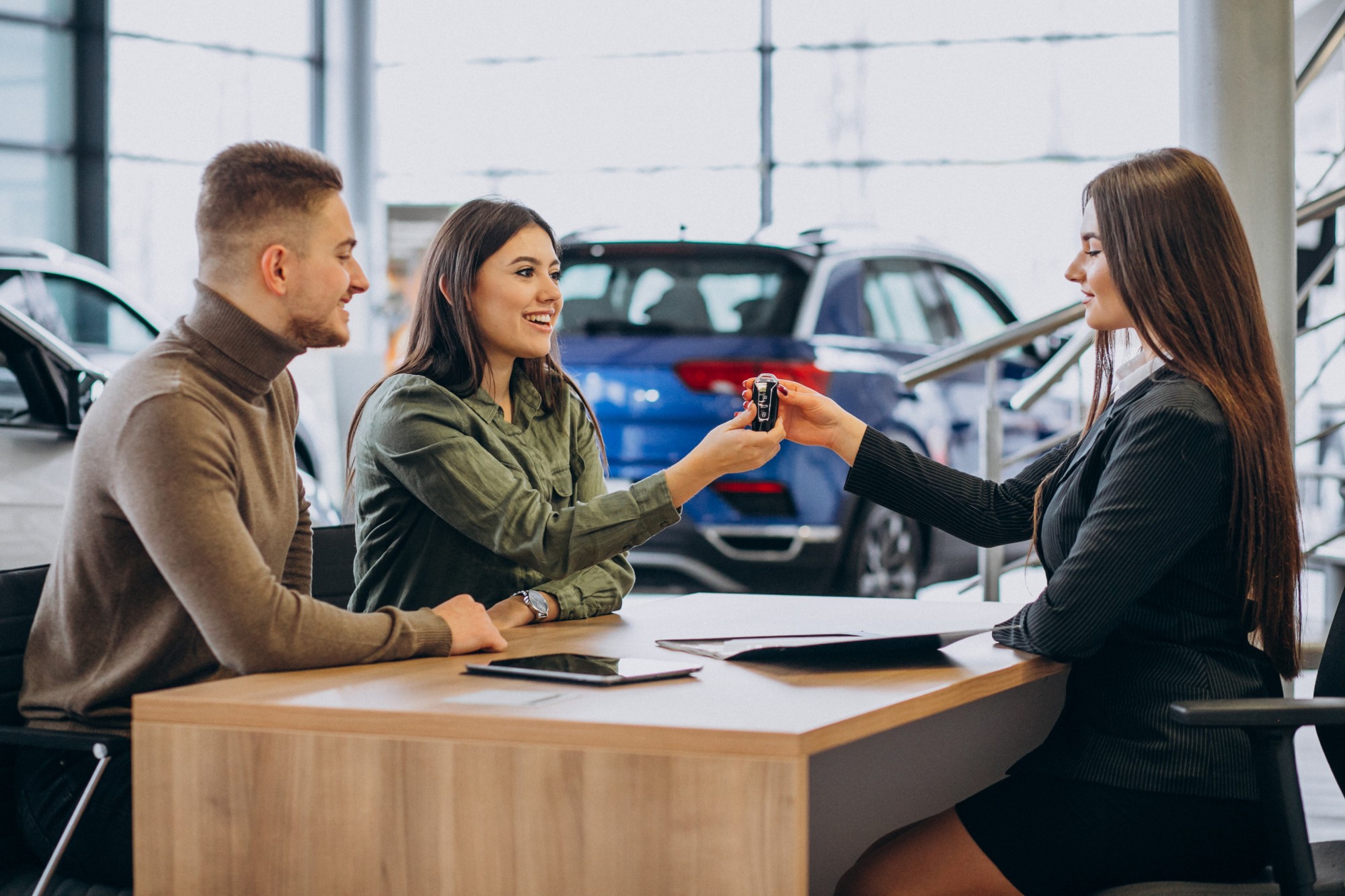 Illustration of a young couple buying a car at a dealership