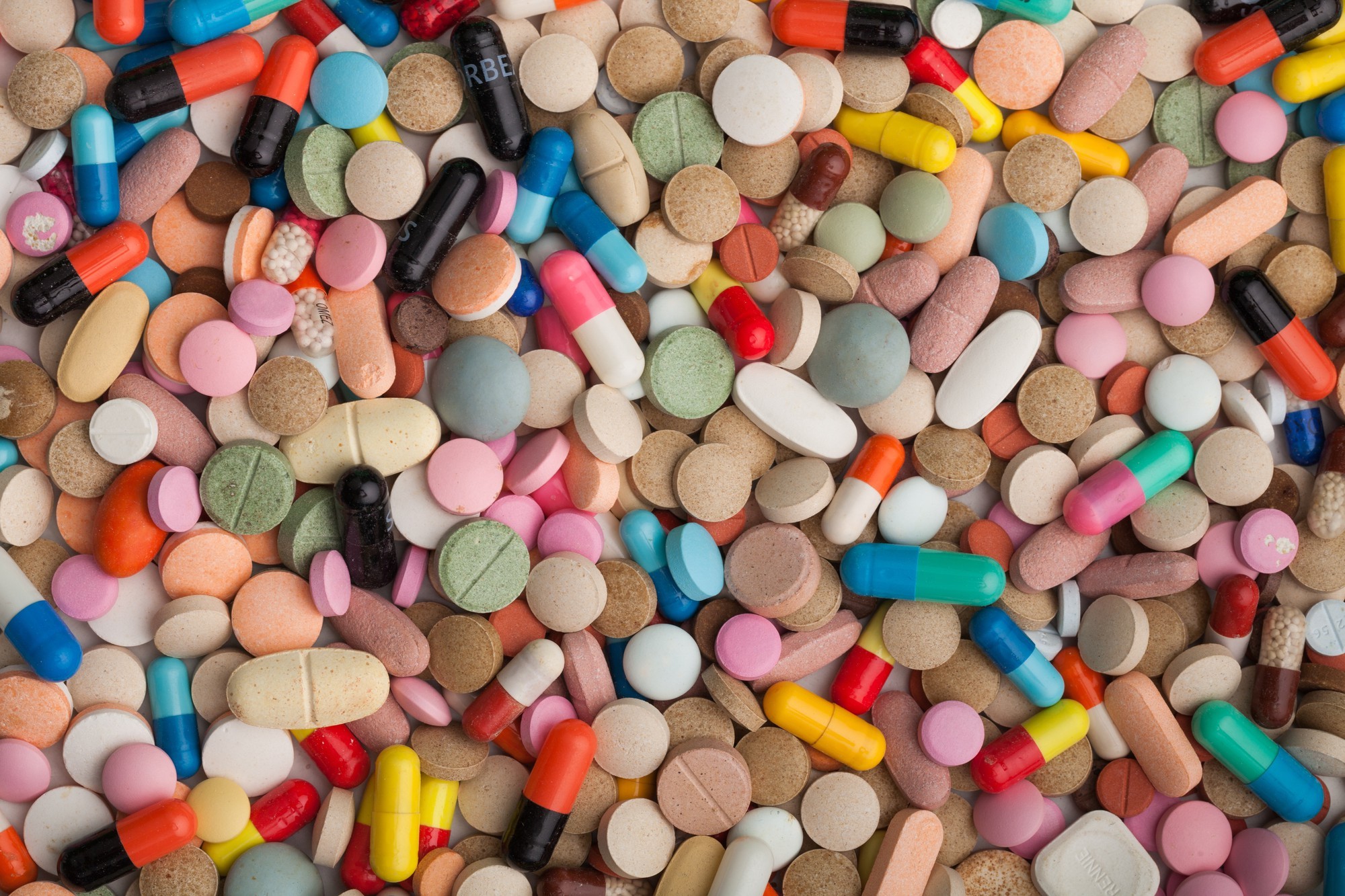 Illustration of black market medicine depicting a variety of pills mixed