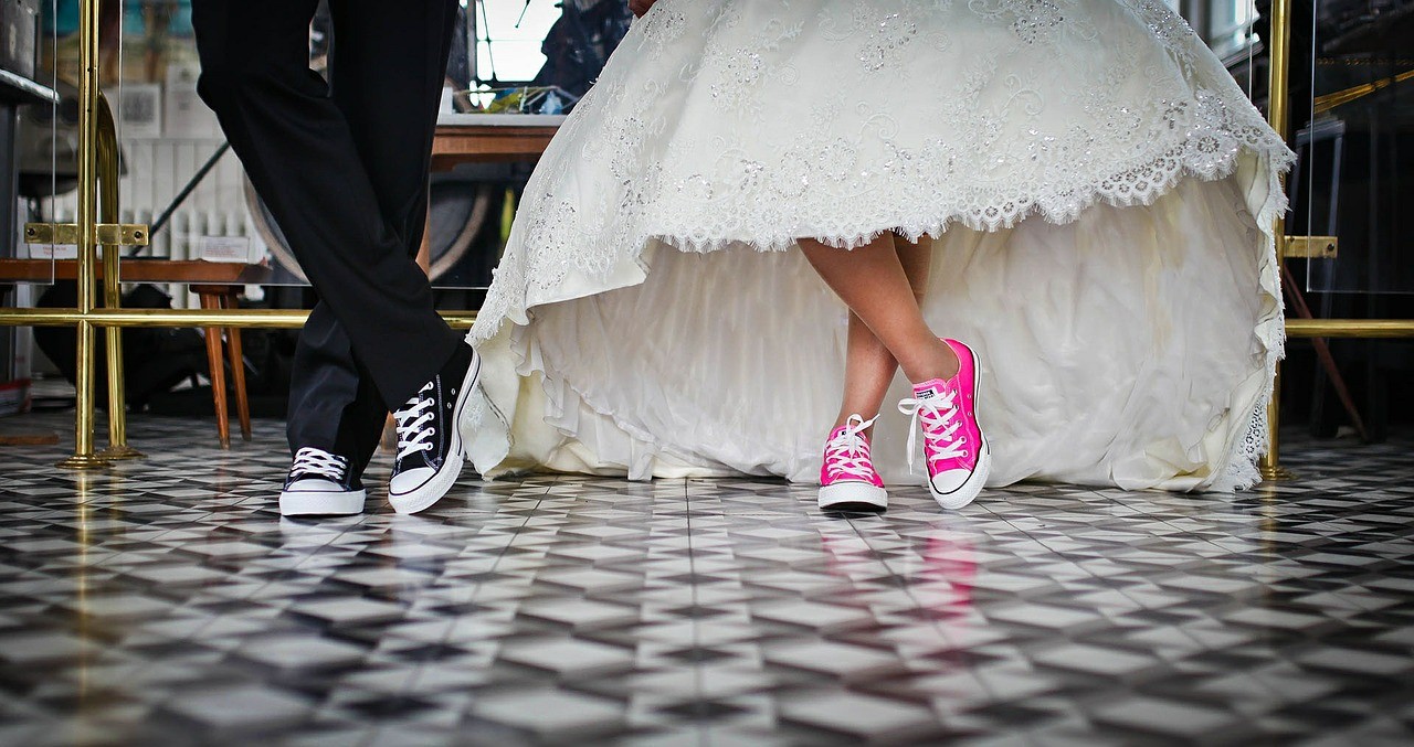 Picture of bride and groom wearing converse sneakers to their wedding