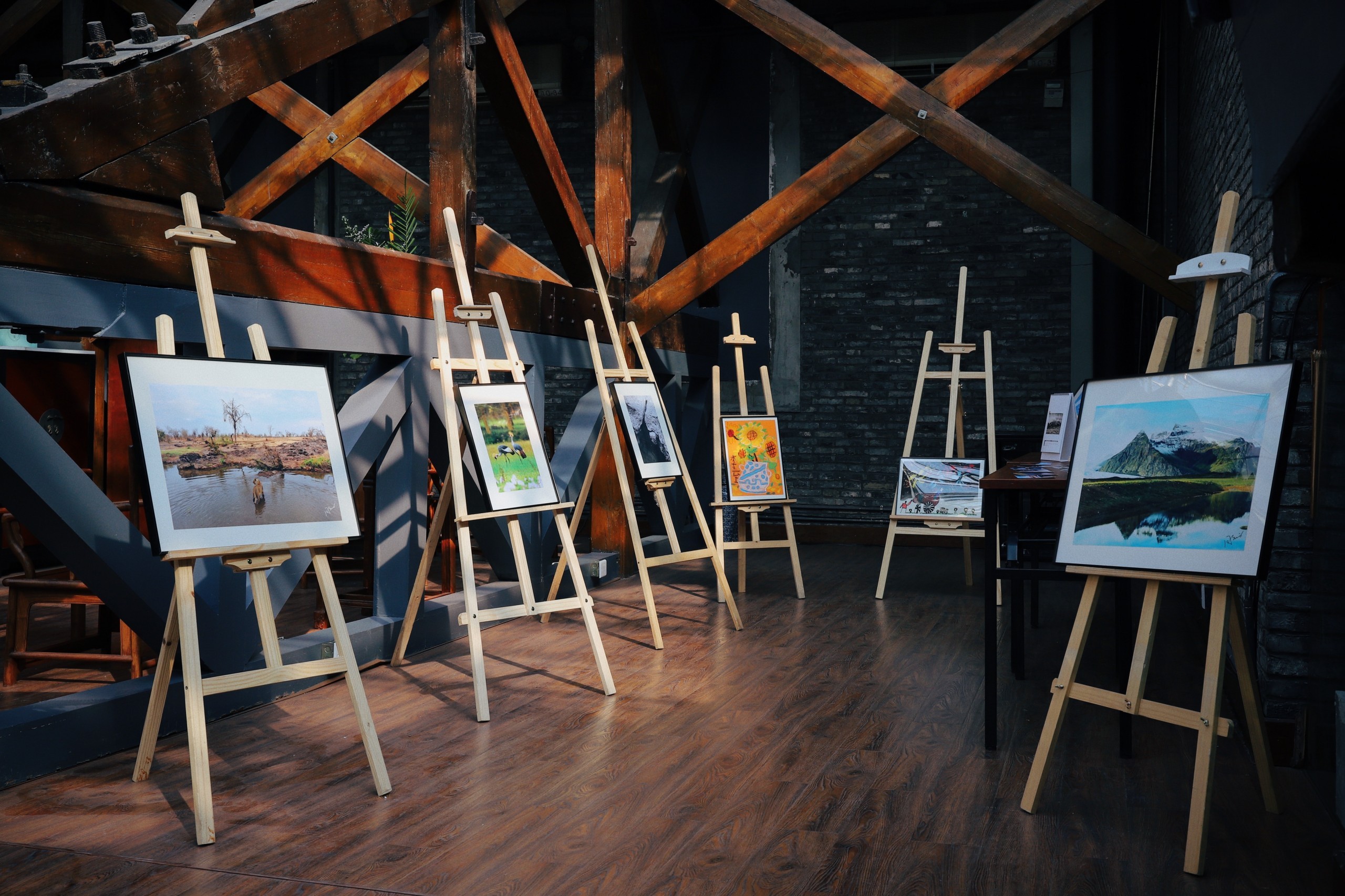 Paintings displayed on easels