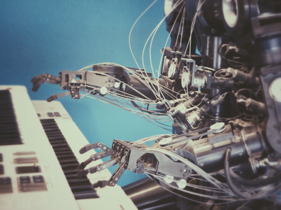 Image of a robot playing an electric piano