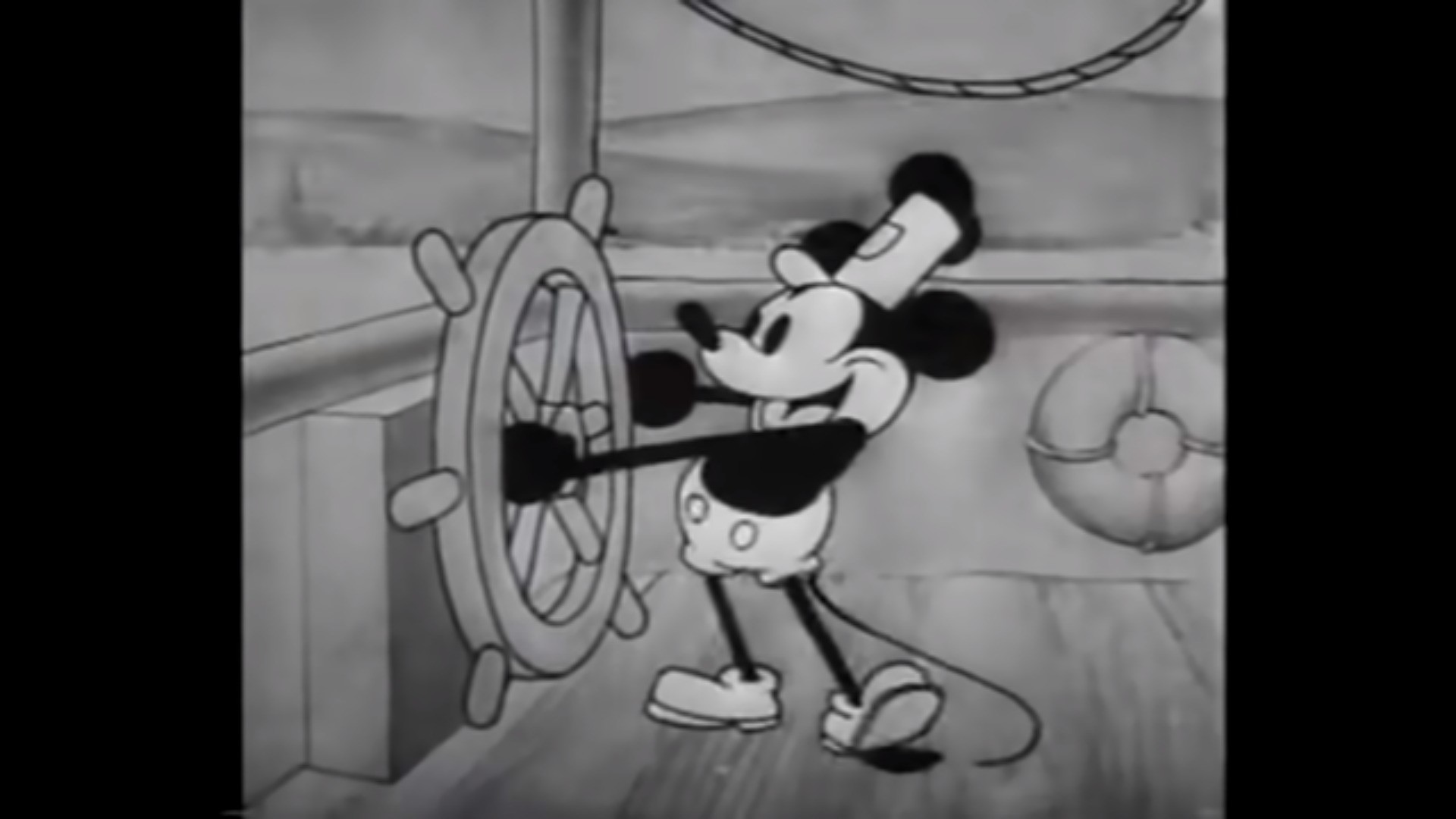 Screenshot of https://www.youtube.com/watch?v=BBgghnQF6E4 displaying a still image from the cartoon Steamboat Willie 